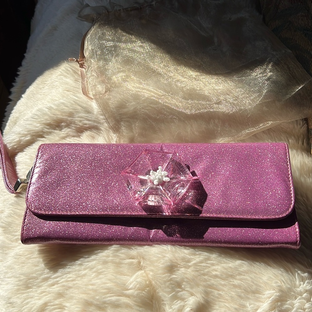 Vintage casadei clutch sparkly pink with large flour detail on front.
